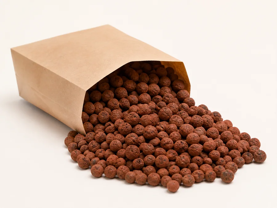 Expanded clay pebble grow media spilling from a kraft paper bag